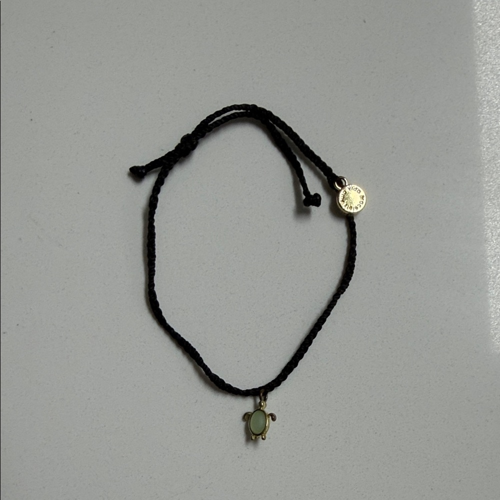 Pura Vida Black Bracelet with Gold and Green Accents